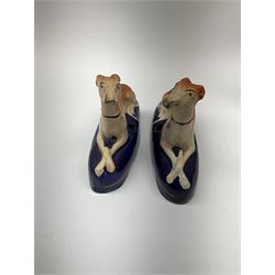 A group of Victorian Staffordshire and later figures modelled as greyhounds, to include a pair of pen stands, largest H20cm. 