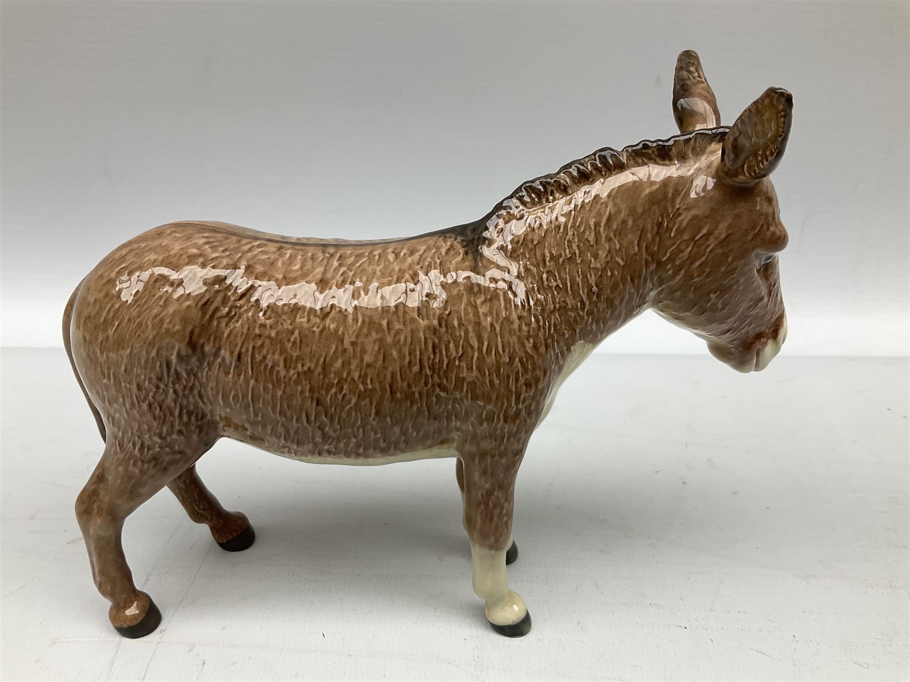 Beswick donkey family to include no.1364b, no.2267a, another donkey and donkey foal (4)