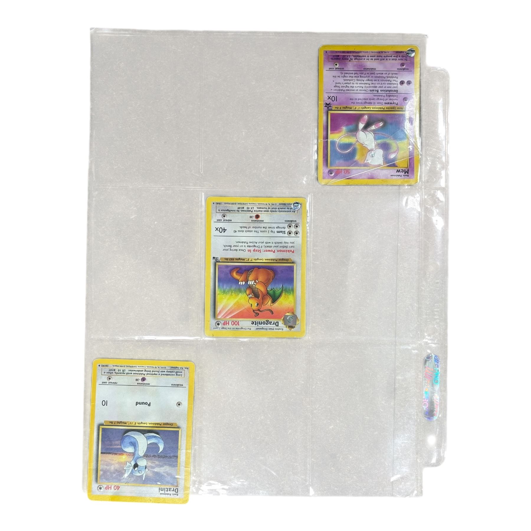 Collection of mainly vintage Pokemon cards including Charizard Base Set Holographic number 4/102 and two Ancient Mew 2000 promo cards, some housed within plastic wallets and some loose