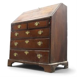 18th century inlaid oak bureau, the fall-front with central star inlay enclosing fitted interior with central cupboard flanked by fluted column correspondence drawers and pigeon holes, over two short and three long drawers, lower moulded edge on bracket feet