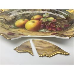 Early 20th century Royal Worcester dish decorated by Thomas Lockyer, oval form with gilt shaped rim and twin shell handles, hand painted with a still life of fruit upon a mossy ground, signed T Lockyer, with puce printed mark beneath and date code for 1922, for restoration, W31cm