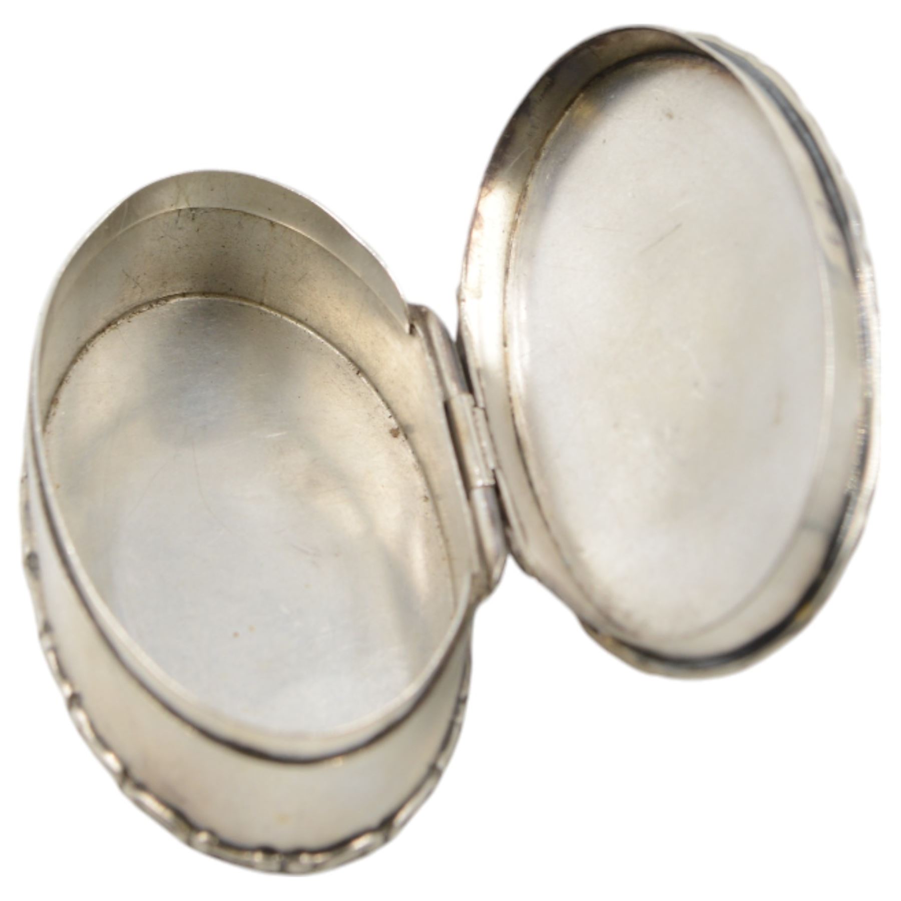 Edwardian silver trinket box, of oval form with embossed scroll rim, the hinged cover inset with a jasperware roundel depicting a classical scene, hallmarked Cohen & Charles, Chester 1905, H2.5cm, W7.5cm