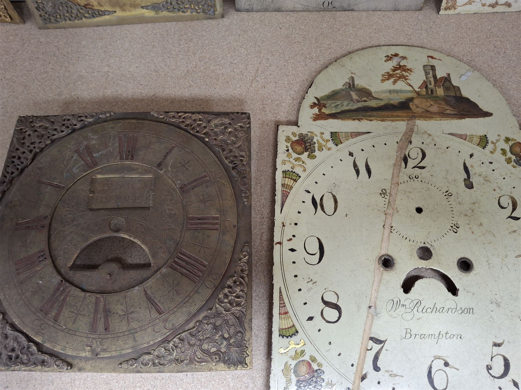 Approximately twenty-two longcase and wall clock dials, 18th century and later, included painted and brass examples