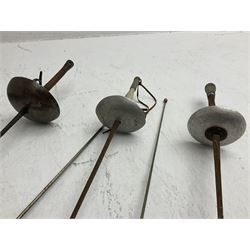 20th century Indian Tulwar sword with 71cm plain curving steel blade and iron hilt with extended langets, knopped grip and spiked pommel; in canvas covered wooden scabbard L87.5cm overall; together with five fencing swords comprising four foils and one epee, three marked Leon Paul, one in carrying case (6)