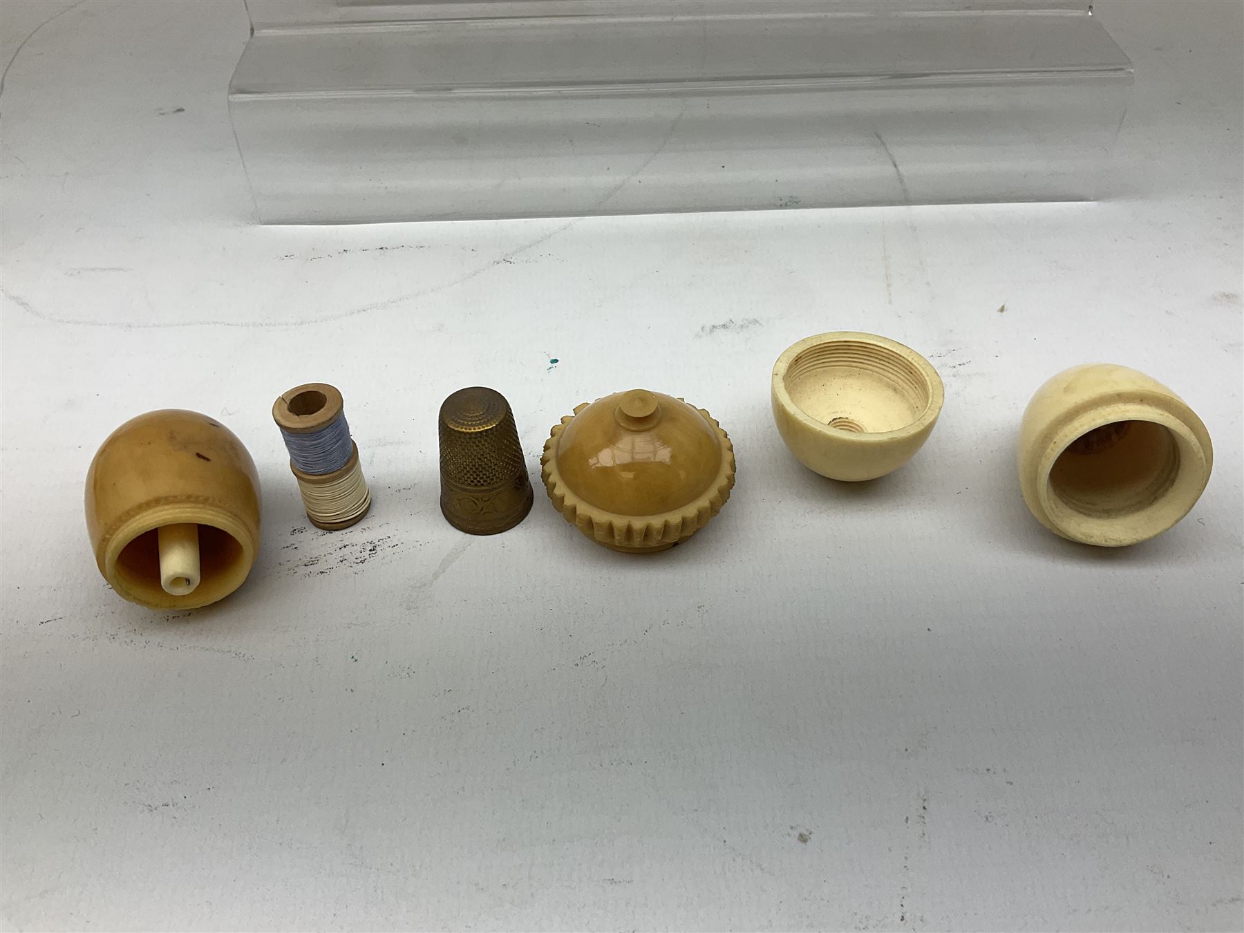 19th century bone and vegetable ivory sewing items including needles cases, pin cushions, thimble cases etc