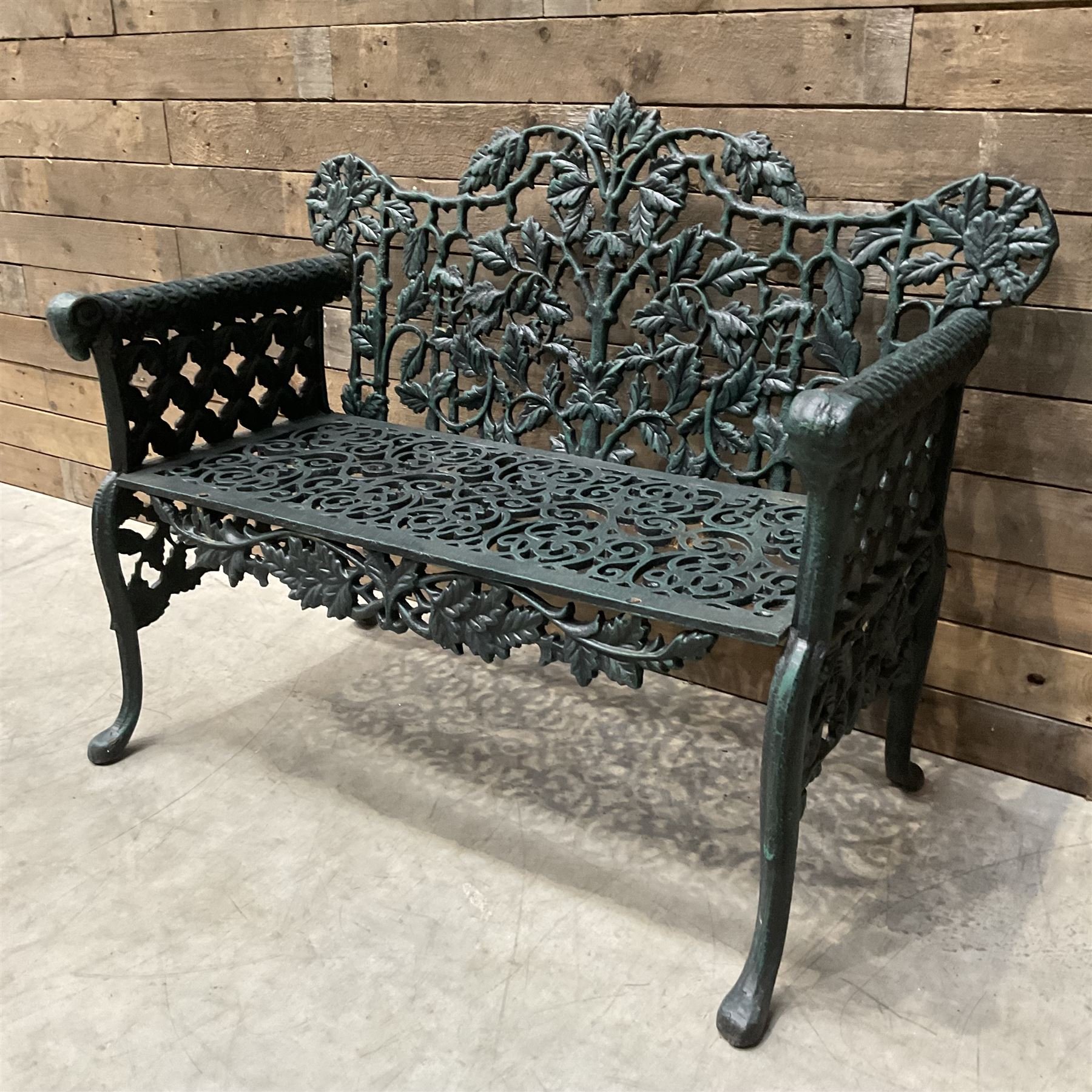 Victorian design heavy cast iron garden bench, ornate shaped back with rope twist and ramshead arms H88cm, W100cm