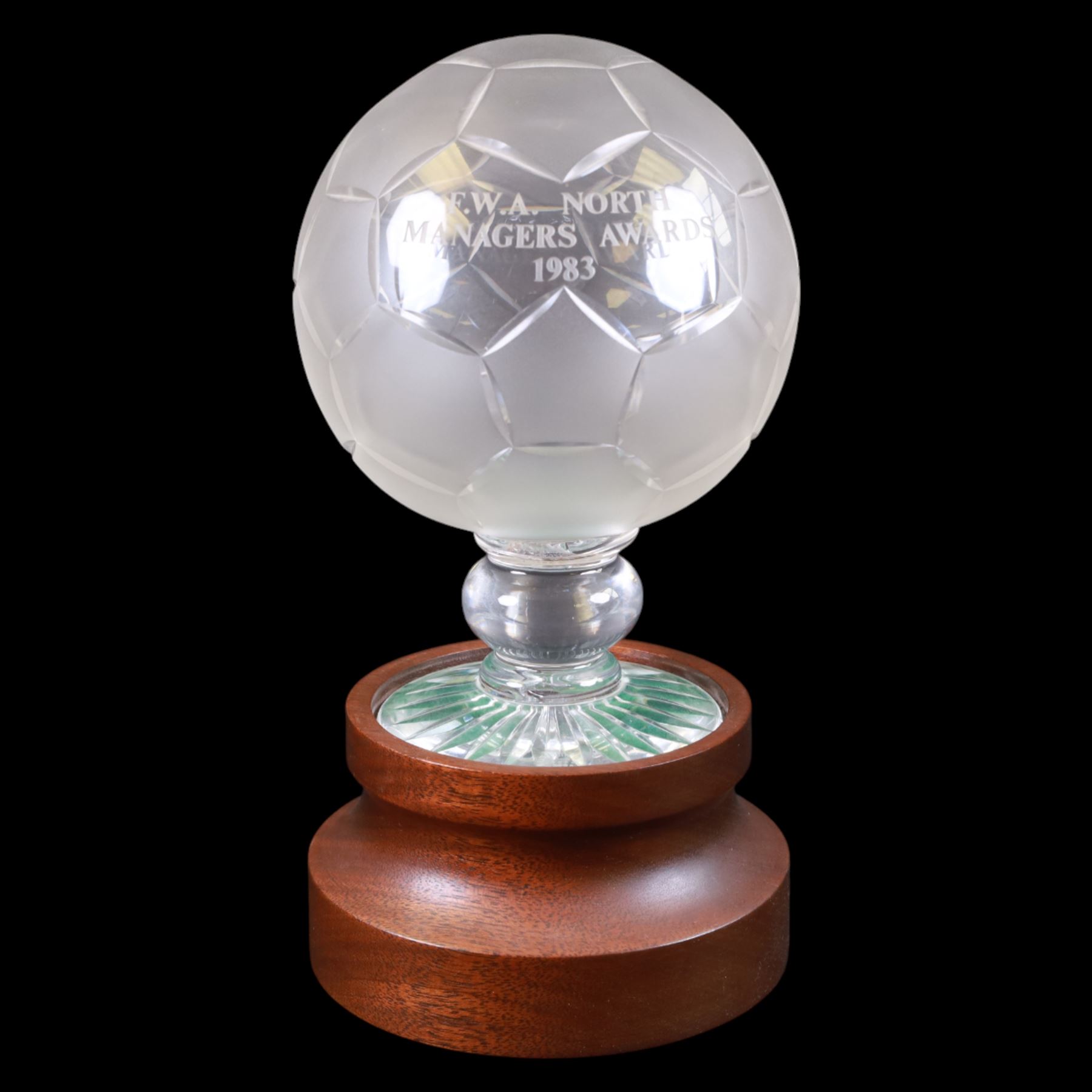 Royal Doulton crystal football trophy, modelled as a football with frosted panels, presentation engraving reading FWA North Managers Awards 1983, upon a wooden socle plinth, height including plinth H26cm
