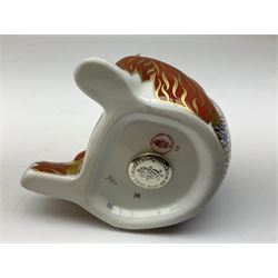 Four Royal Crown Derby paperweights, Llama, with gold stopper, Snake, with gold stopper, Honeybear, with silver stopper and Striped Dolphin, with gold stopper and box, all with printed mark beneath 