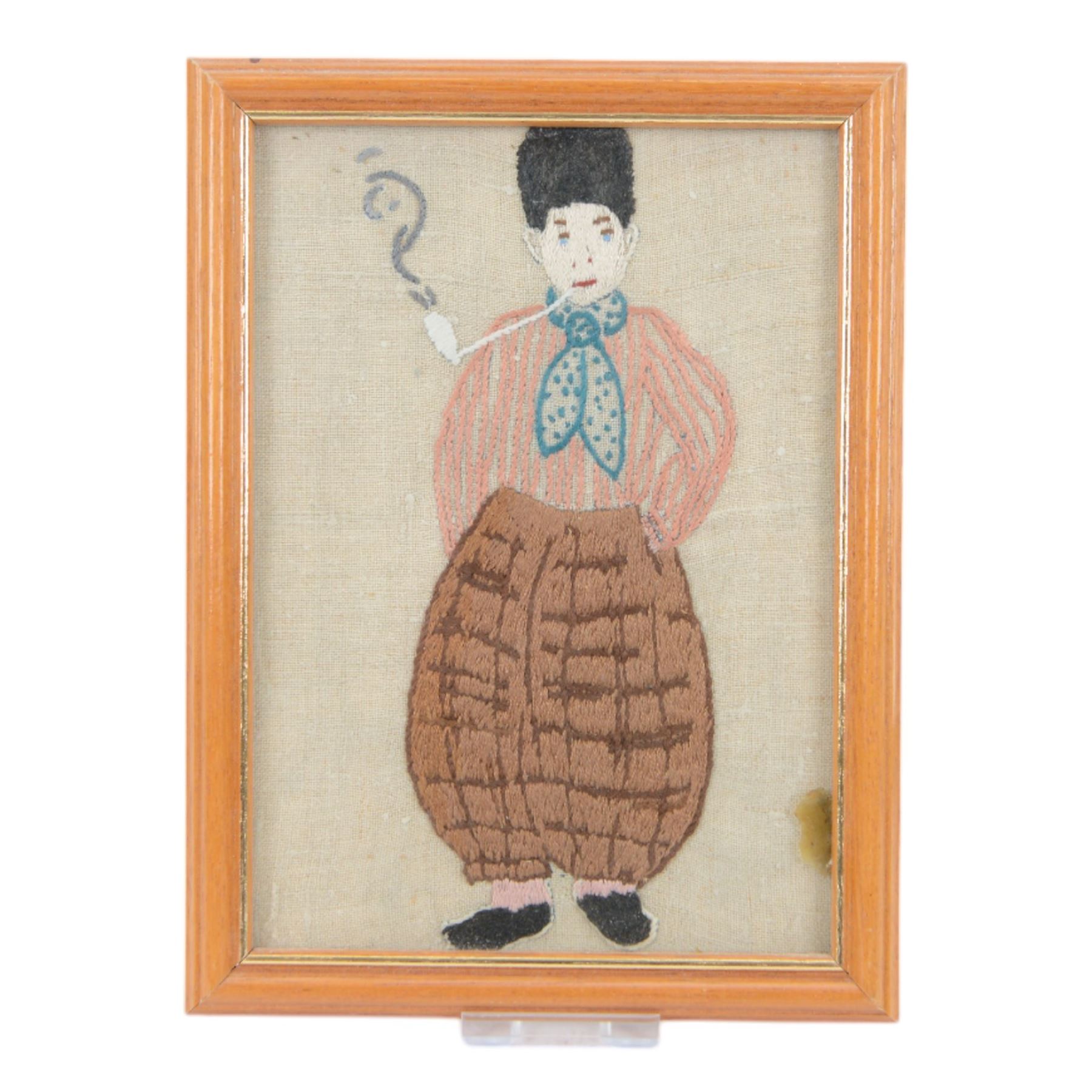 Four silkwork embroidery portraits, including two Dutch women, man smoking a pipe and a woman in period dress, all framed