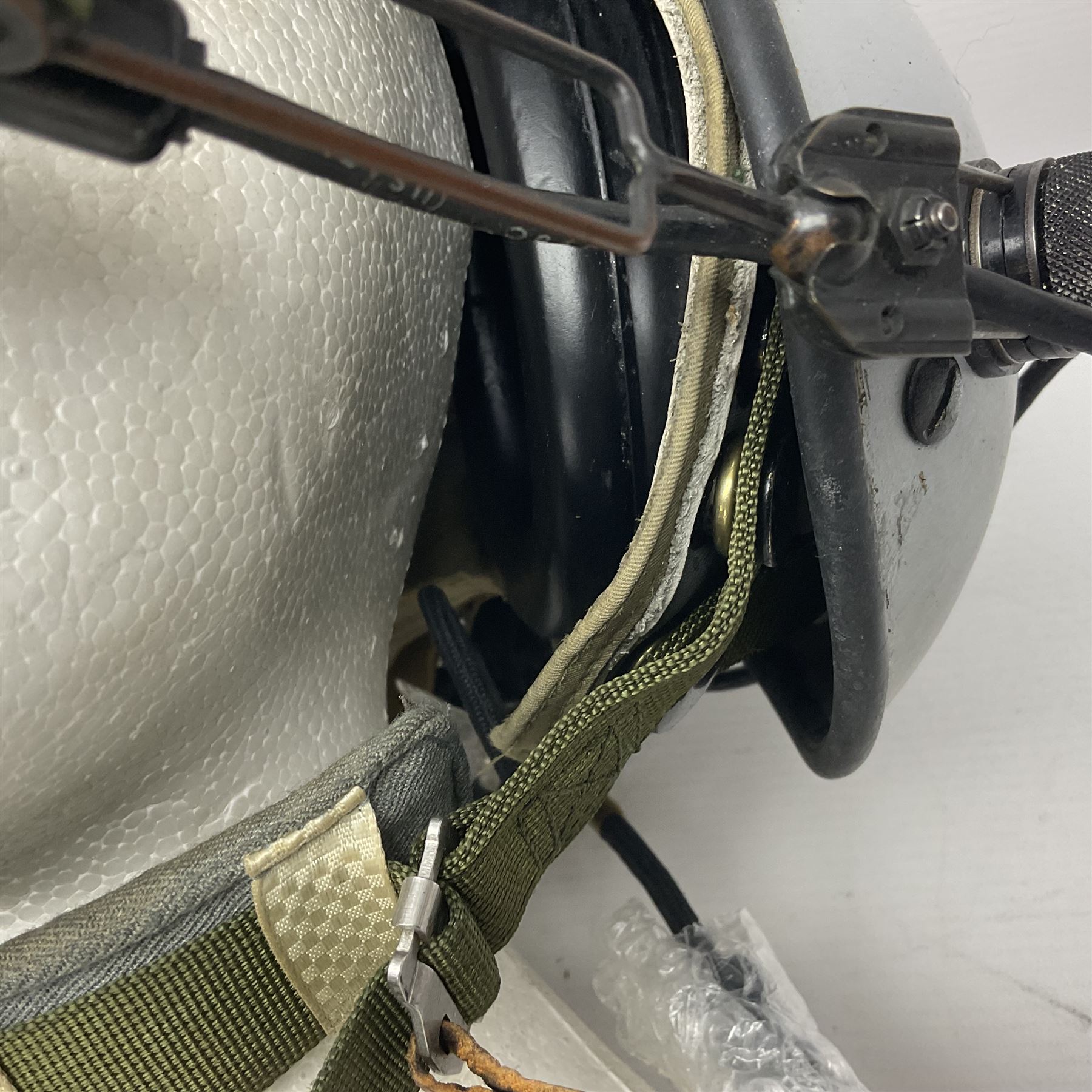 Silver grey SPH-4B Flight Helmet as used by helicopter pilots in the USAF and US Army in the 1990s; made of epoxy resin reinforced fibreglass; fitted with clear and tinted visors and complete with an M-87A/AIC boom mike; original condition and bench tested.