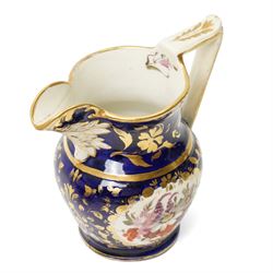 Collection of early 19th century Coalport pattern tea ware decorated with panels of flowers within a blue and gilt surround comprising eight tea cups, three coffee cups, eight saucers, four large plates, two handled sucrier and cover, milk jug and slop bowl and a similar small dish with loop handle