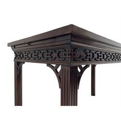 In the manner of Thomas Chippendale - early 19th century mahogany serving table, rectangular crossbanded top with boxwood stringing, the frieze with upper moulding over applied geometric fretwork, the left-hand side fitted with slide, on fluted square supports with inner chamfer 