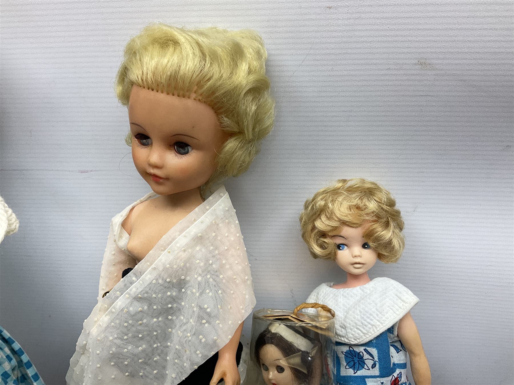 1960s Pedigree hard plastic walking doll H41cm two fashion dolls quantity of doll s clothing by Faerie Glen Pedigree etc and small collection of National Costume dolls together with Dinky die cas Deco...