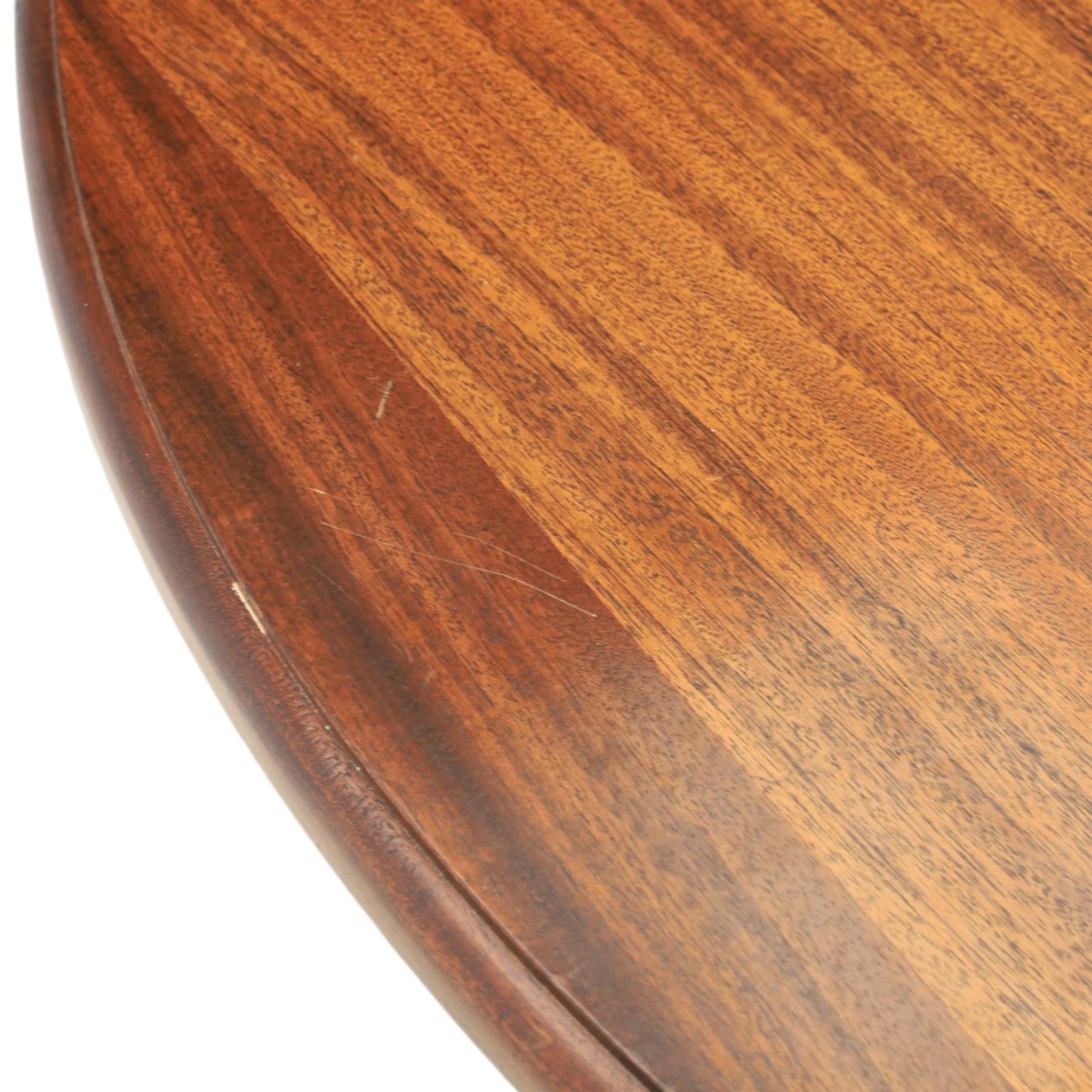 Regency design mahogany extending twin pedestal dining table with two additional leaves, raised on splayed supports terminating brass paw feet
Extends to 268cm