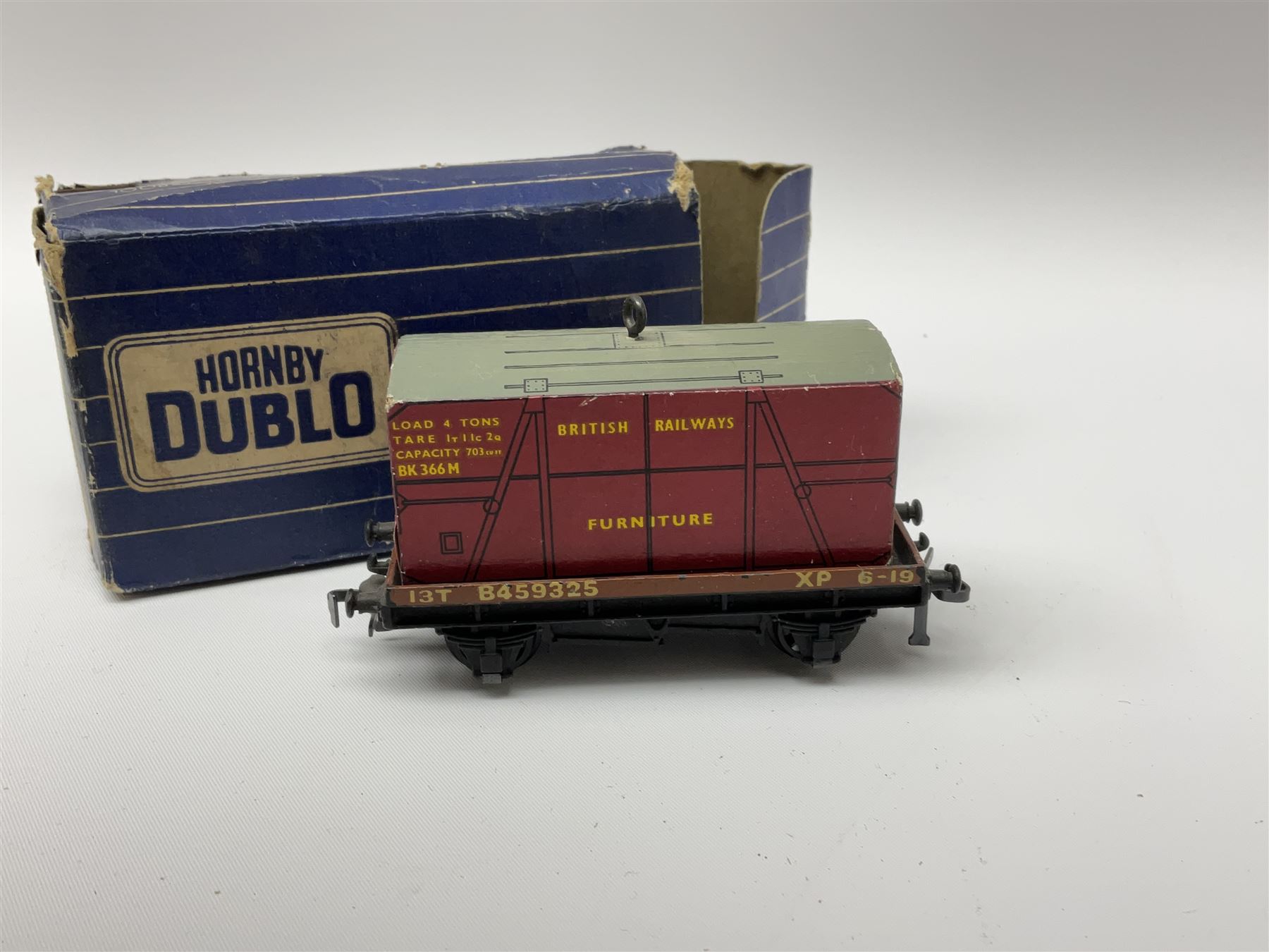 Hornby Dublo - twenty wagons including Cattle Trucks; Low-Sided Wagons; Cable Drum Wagons; Tank Wagon for Shell Lubricating Oil; Mineral Wagons; 20-Ton Bulk Grain Wagons; Goods Brake Vans; Furniture Containers etc; all in blue striped boxes (20)