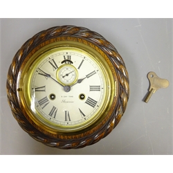  20th century oak case Bulkhead type Clock, circular white Roman dial with subsidiary seconds, Ansonia twin train 8-day movement  in rope carved oak surround with brass bezel, D22.5cm    