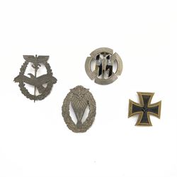 Four German style badges, including Iron Cross, German Proficiency SS runes badge, etc together with a reproduction German cap 