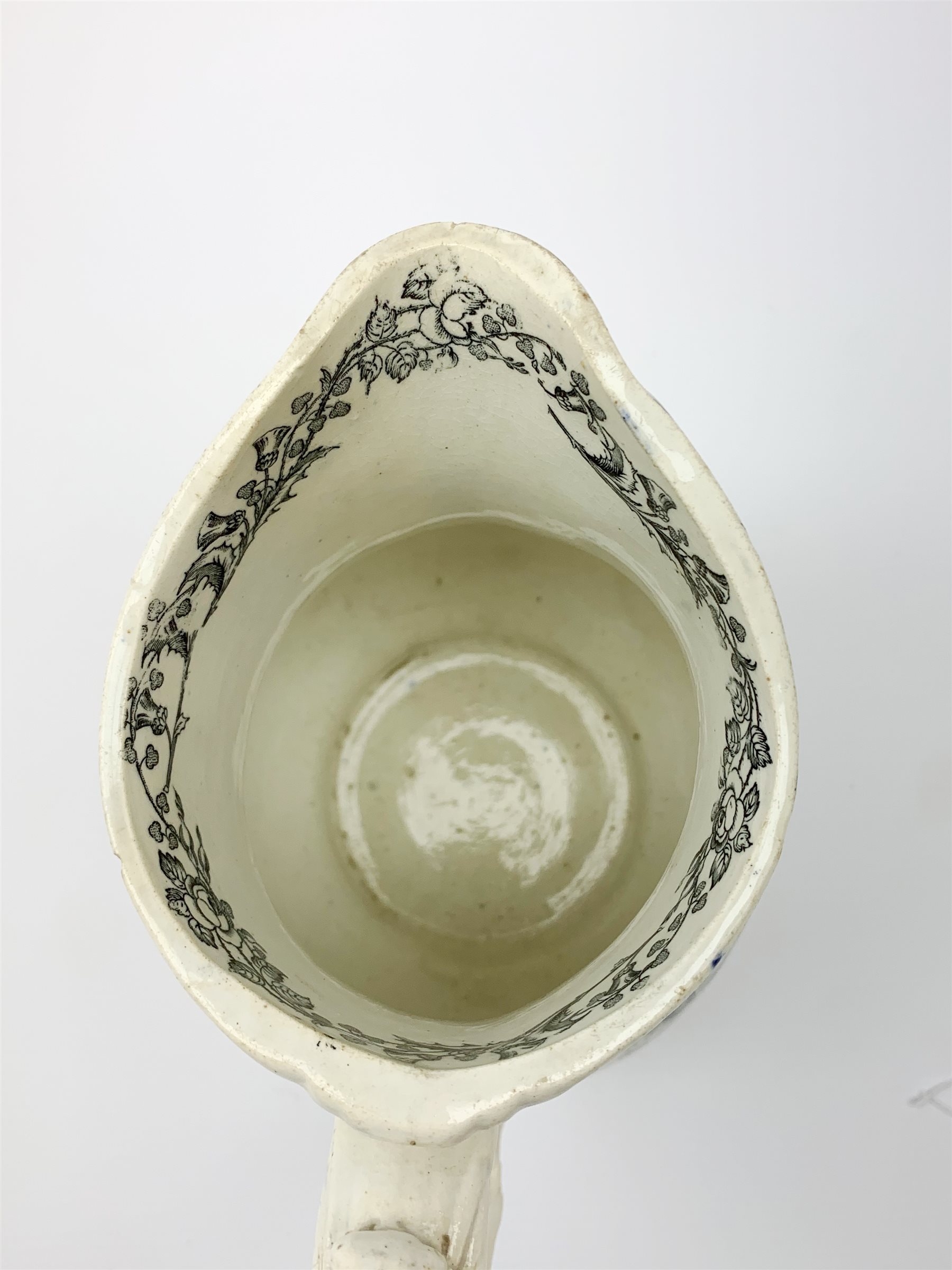 A 19th century Staffordshire pottery pearlware Crimea commemorative jug, black transfer printed with battle scenes, entitled Battle of Alma, Charge of the Highlanders, and Storming the Malakhofi, H18cm. 