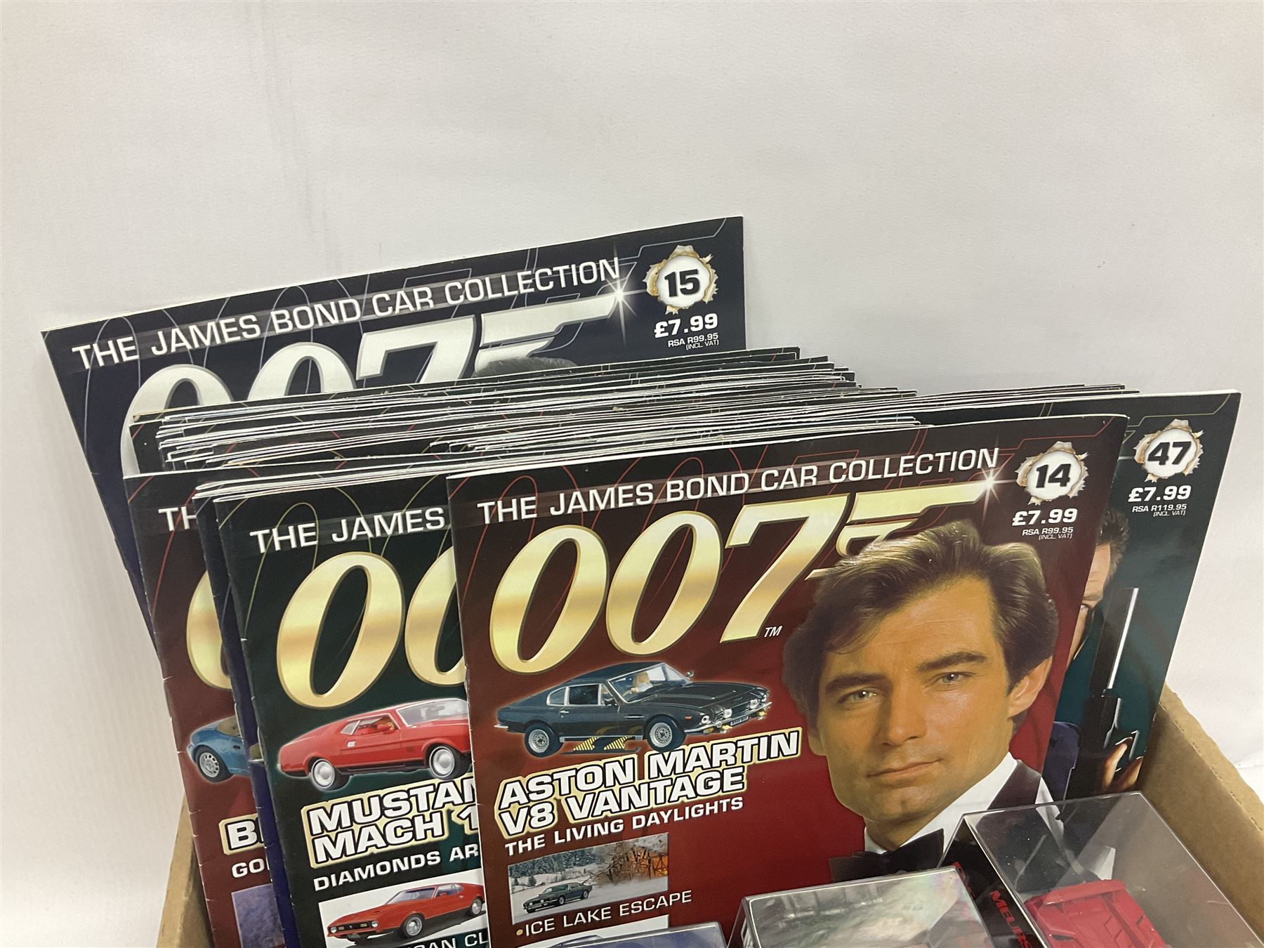 Fabbri James Bond Collection - over one hundred and ten die-cast models in perspex display cases as issued periodically; and a quantity of associated magazines and trading cards, in five boxes