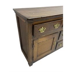 George III country oak dresser base,  rectangular top over with three central drawers flanked by two drawers and two panelled cupboards, each with moulded fronts, on stile feet