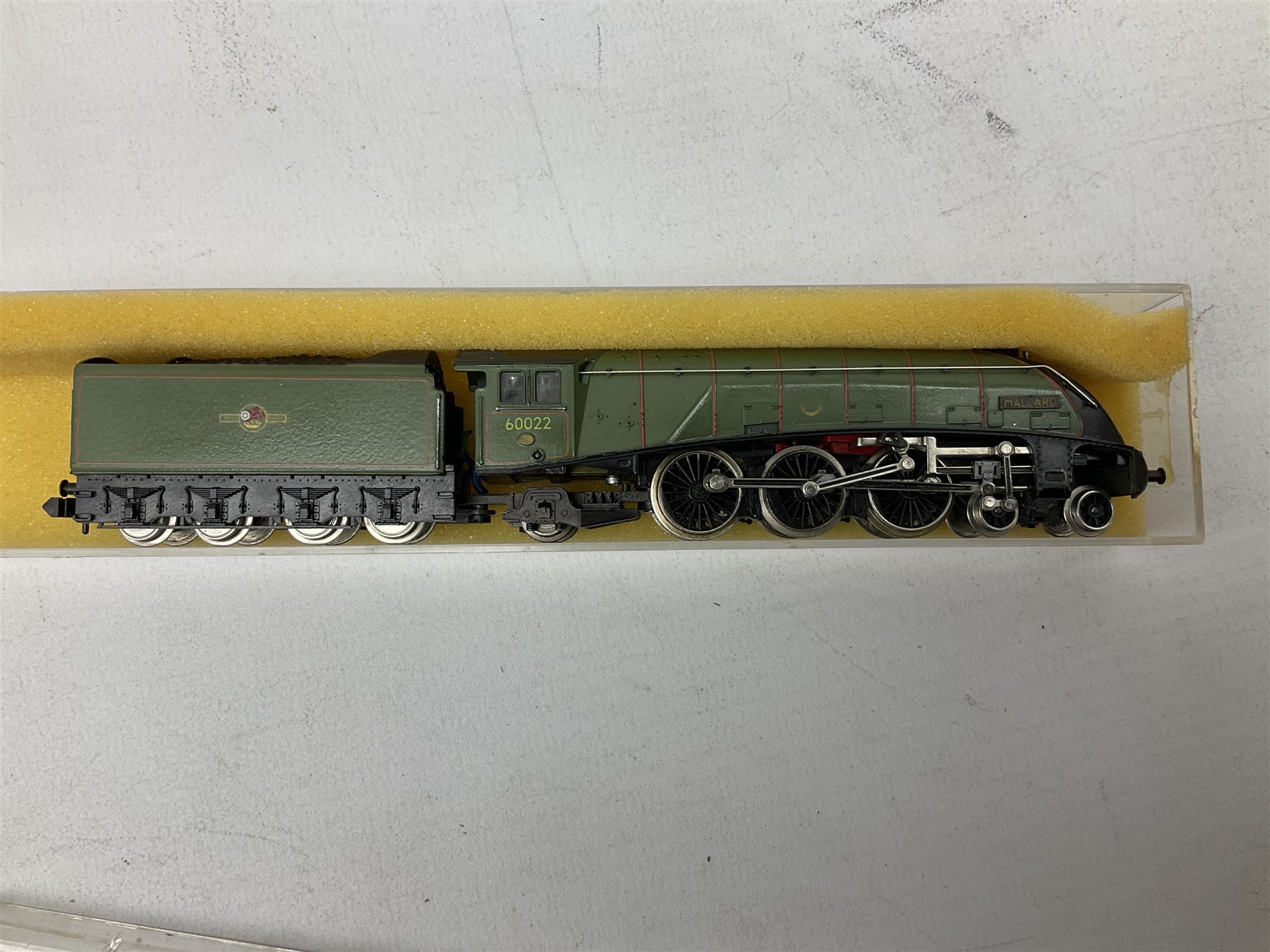 'N' gauge - Minitrix Class A4 4-6-2 locomotive 'Mallard' No.60022; in hard perspex case; Lima Diesel Shunter No.D2790; boxed; 0-6-0 locomotive 'Margaret' with four Colin Ashby EDLR coaches and three wagons; and Egger-Bahn 0-4-0 locomotive No.5 with two coaches in hard plastic boxes (13)