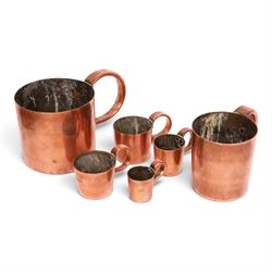 Set of six 19th century copper tankard measures comprising 1/2 Gallon, Quart, 1/2 Pint and 1 1/2 Gill, Gill and 1/2 Gill