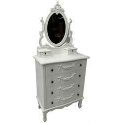 French design white painted dressing chest, oval swing mirror with floral cartouche pediment over two trinket drawers, serpentine chest fitted with four drawers, the facias with applied swags with flower heads
