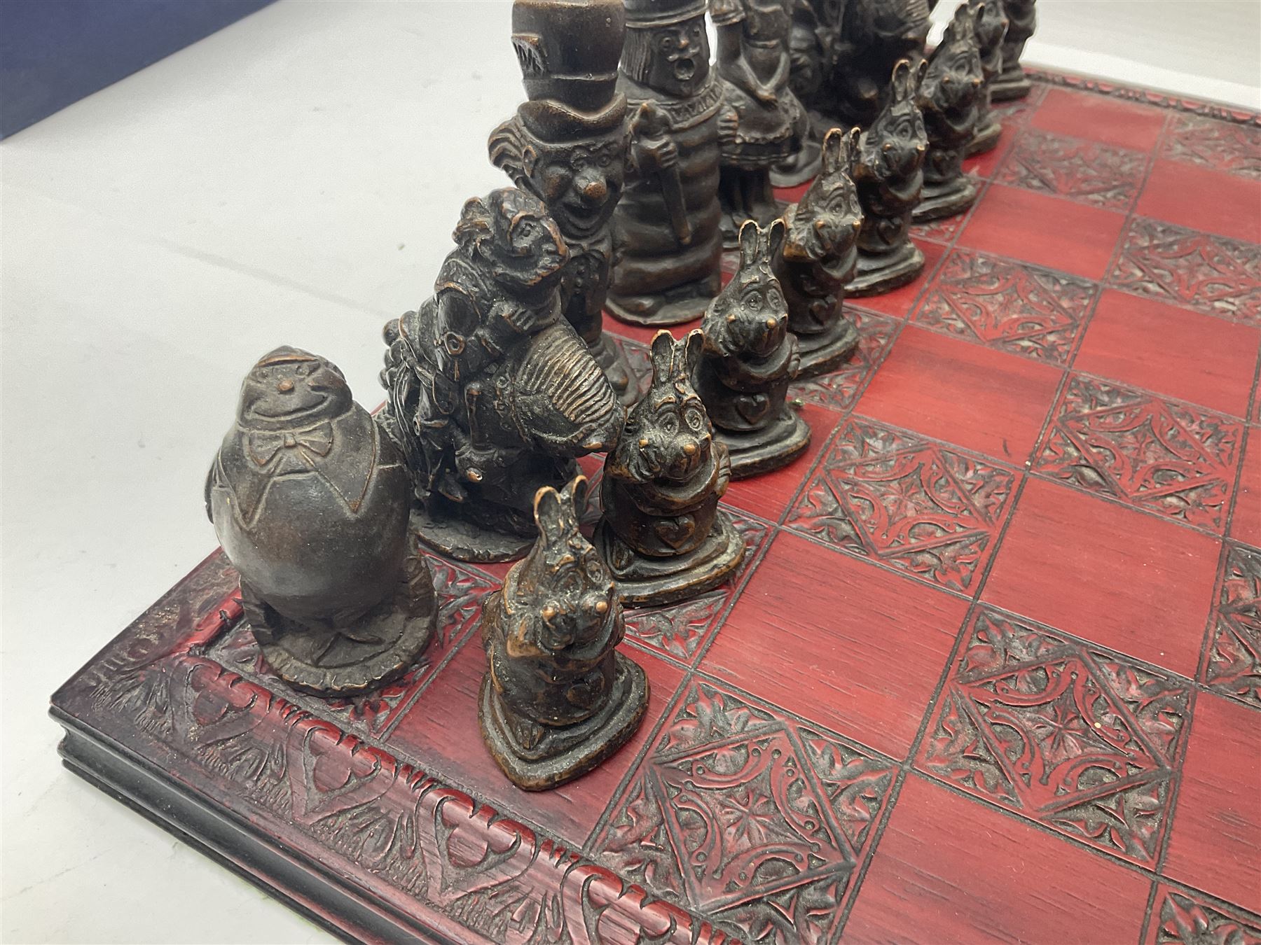 Alice in Wonderland themed chess set, with a complete set of composite figures, modelled as characters including Alice, Tweedledum and Tweedledee, the White Rabbit and the Mad Hatter, etc