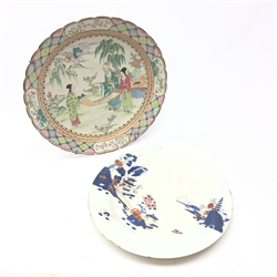  19th/ 20th century Chinese charger painted in polychrome enamels with three figures painting a scroll, D40cm and an 18th/ 19th century Chinese charger painted in the Japanese style with Pagodas in a mountainous landscape (2)  