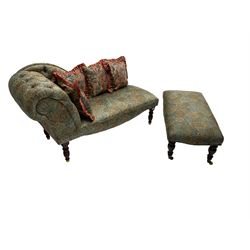 Chaise longue, scrolled back, upholstered in buttoned Liberty style peacock fabric, raised on turned supports, (W140cm, H73cm, D57cm); together with matching footstool on turned supports with brass castors (W94cm, H37cm, D47cm) and four scatter cushions