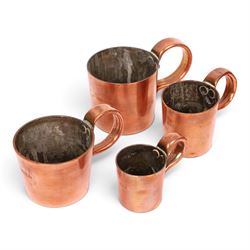 Set of six 19th century copper tankard measures comprising 1/2 Gallon, Quart, 1/2 Pint and 1 1/2 Gill, Gill and 1/2 Gill