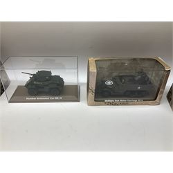 Sixteen Atlas Editions die-cast models of military vehicles including six Ultimate Tank Collection; all in perspex display cases; fourteen boxed; with associated paperwork (16)