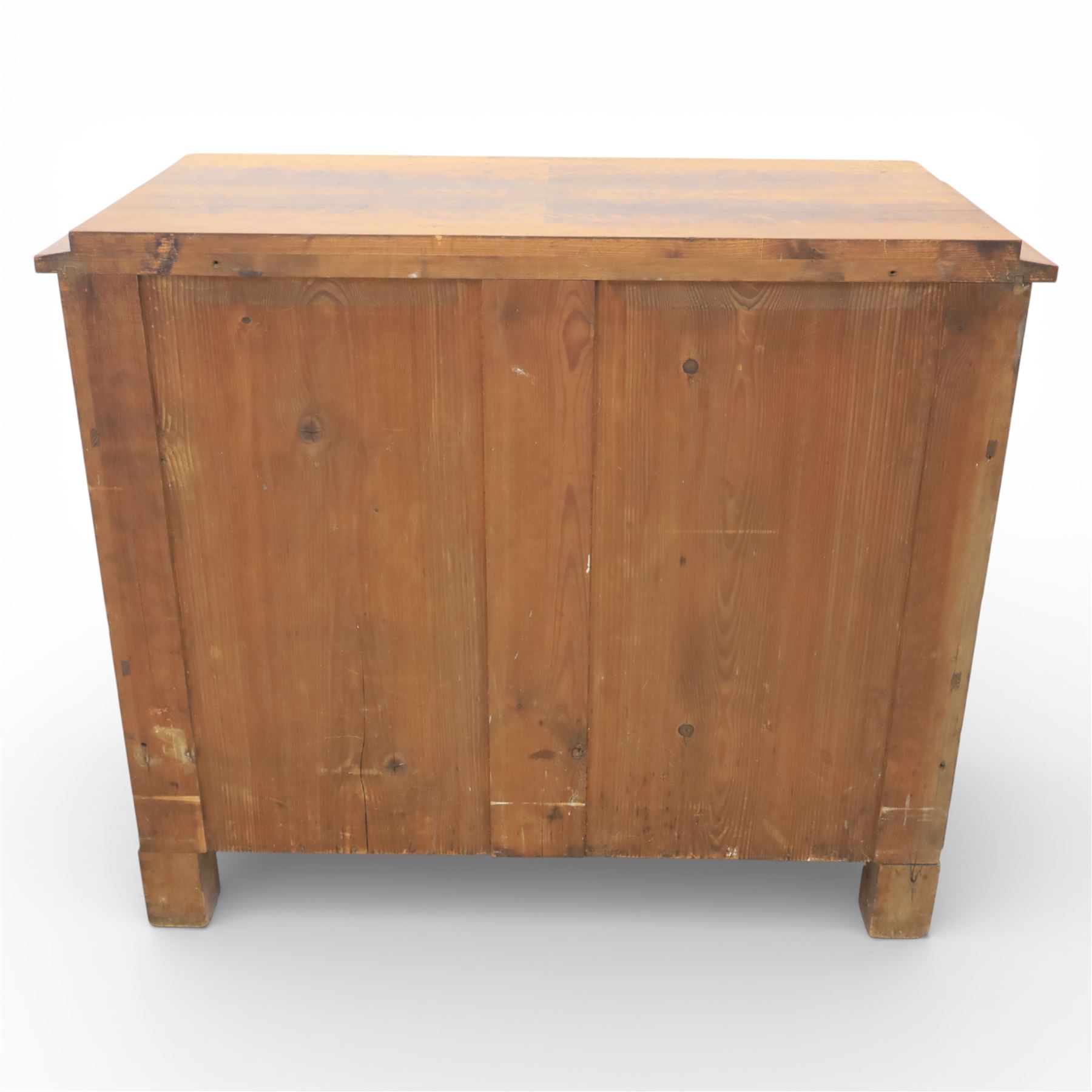 Late Victorian walnut and burr walnut chest of drawers, moulded top with rounded corners, finely figured burr walnut drawer fronts arranged as three long drawers, brass batwing handle plates, the lower section raised on turned bun feet