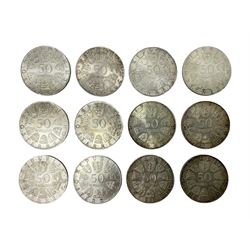 Twelve Austria silver 50 Schilling coins, dated 1971, 1972, two 1973 and eight 1974
