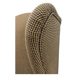 Hardwood-framed wingback armchair, upholstered in dog tooth pattern fabric, on cabriole supports 