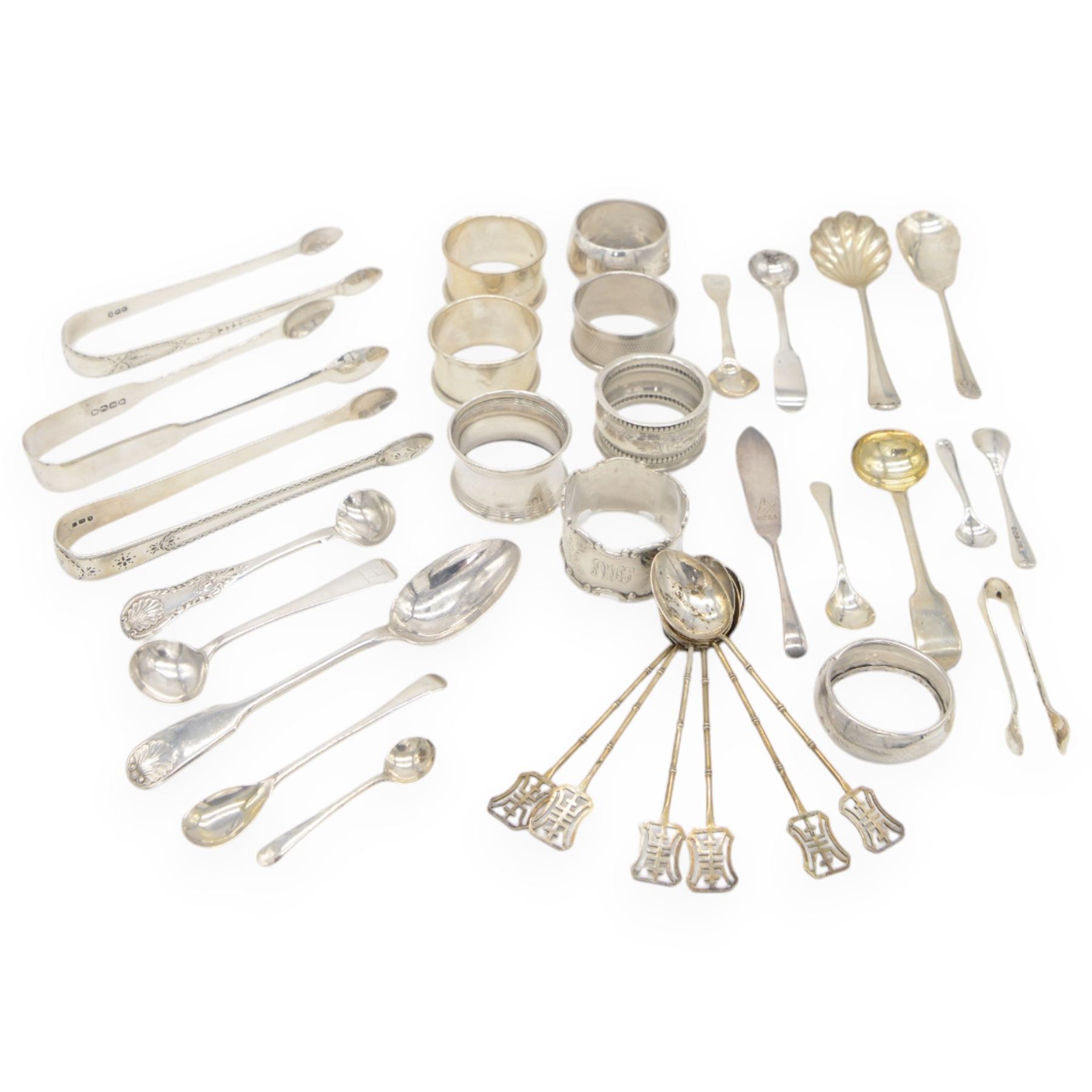 Collection of silver napkin rings and flatware, including set of Chinese bamboo design teaspoons with character mark finials, stamped 90, three pairs of Georgian and later sugar tongs, Scottish silver mustard spoon, hallmarked W S Junior, Glasgow 1833, cruet spoons, coffee spoons, etc, all stamped or hallmarked 