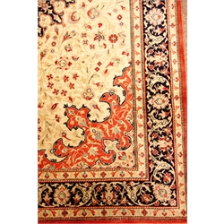  Quoom silk rug, the oblong centre with circular motif on an ivory ground surrounded by floral tendrils and shaped spandrels, within multiple borders incorporating a small scripted panel, in blues, reds, pink and ivory W98cm L150cm Provenance: This lot was gifted to the vendor who worked for the Royal Family of Oman  