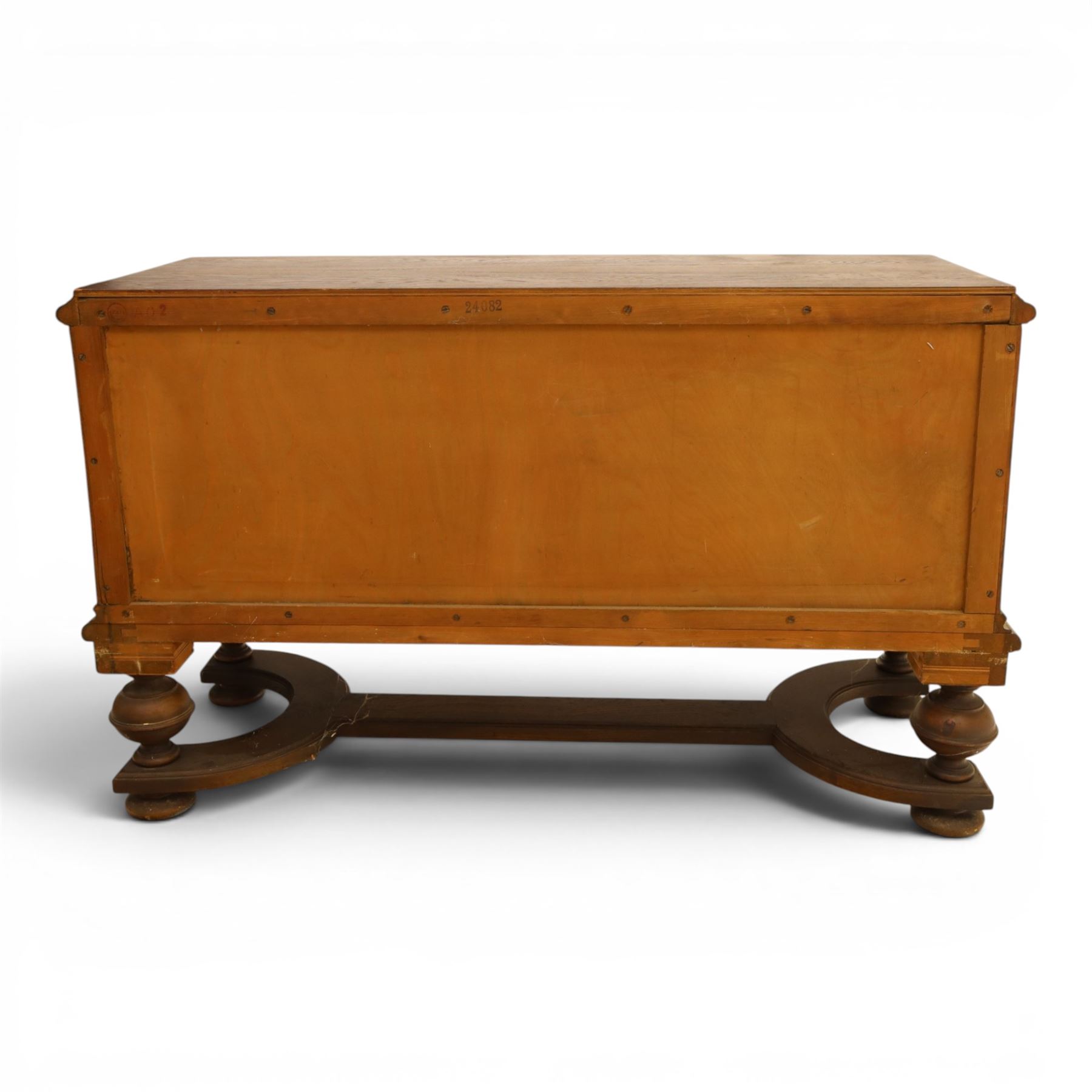 Carved oak coffer bench, rectangular moulded top above carved fall front, with figural, mask and foliate decoration, panelled sides, raised on turned bun feet with shaped lower apron