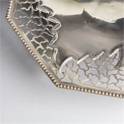 Indian silver dish, of octagonal form with central leaf decoration and pierced sides, upon three feet, W19cm