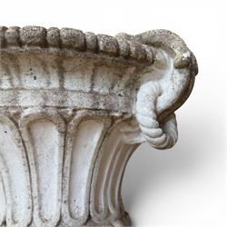 Pair of Neoclassical design cast stone garden urns, each of campana form with fluted body and gadrooned underbelly, decorated with faun/satyr opposing masks and ropetwist handles, with floral and mask design to the socles, raised on square bases, finished in weathered white patina