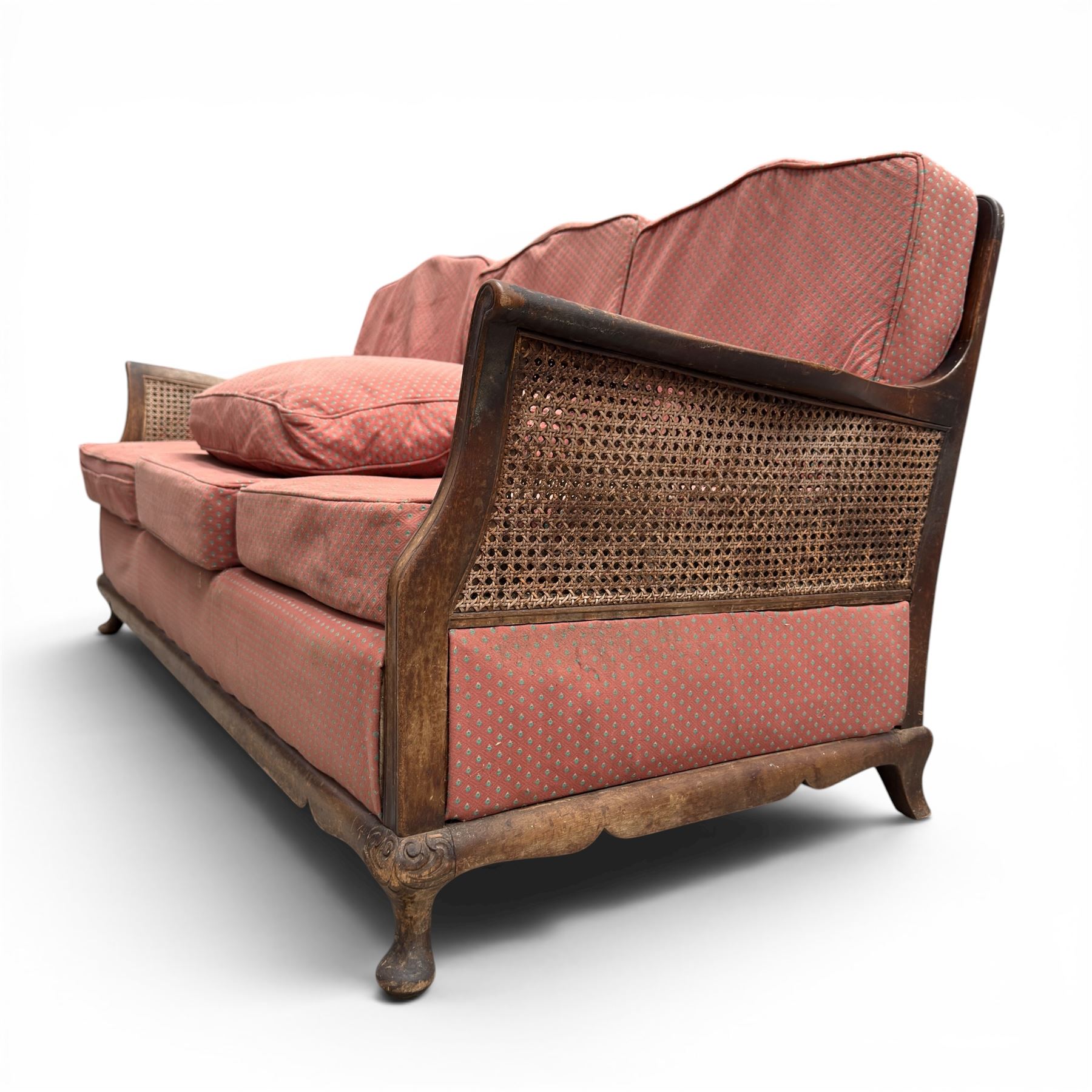 Early 20th century French style bergère conservatory suite, canework back and sides with red upholstered loose seat cushions, on cabriole feet