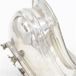 1920s silver sucrier and cover, of oval form with oblique gadrooned rim, the cover with rectangular finial, upon four splayed feet, H10.5cm