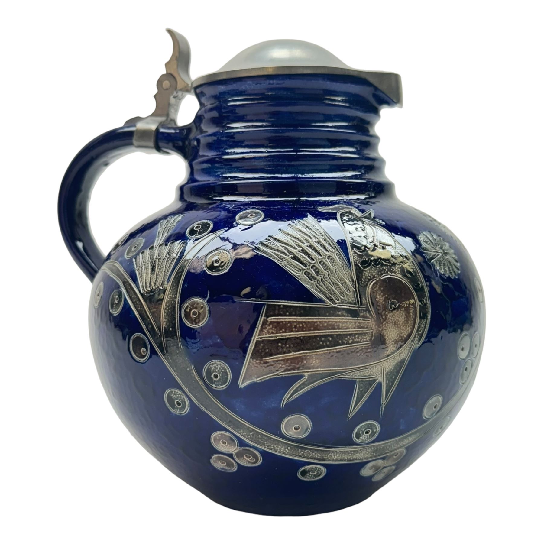 Wim Muhlendyck (1905-1986),  saltglaze stoneware jug of globular form with pulled and applied handle and ribbed neck with white cover, with stylised cockerels and flowers on a dark blue ground, with makers mark beneath, H22cm