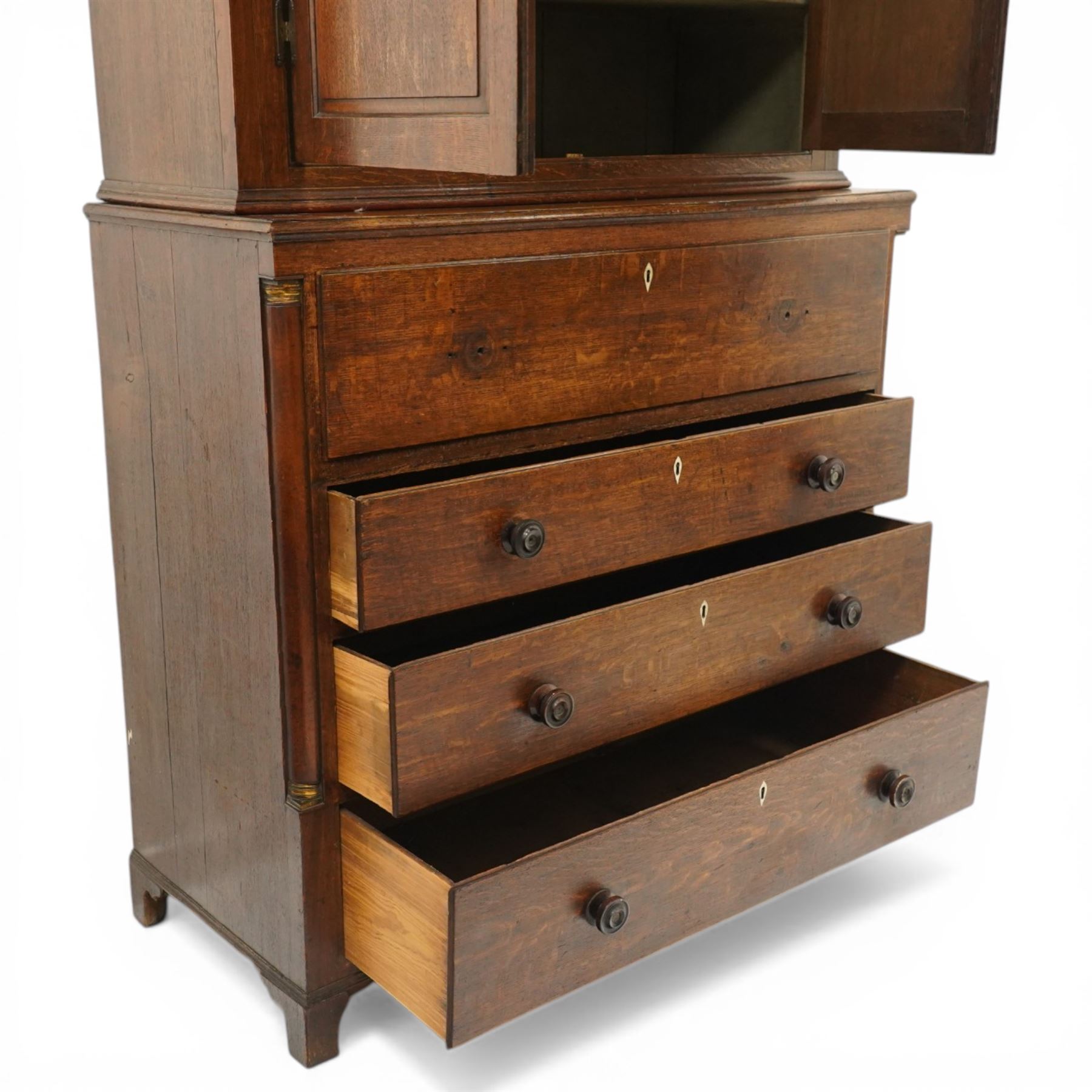 George III oak and mahogany bound enclosed bookcase-secretaire, panelled cupboards over four drawers