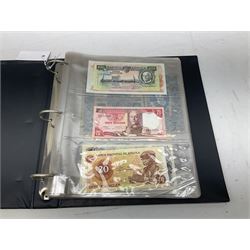 World banknotes, including Queen Elizabeth II The States of Jersey one pound 'DB202703', five pounds 'BB527762' and ten pounds 'AB651481', reserve bank of New Zealand two dollars '1L3 741894', King George V Straits Settlements one dollar 1st January 1935 'F/83 28924', various Bank of England notes etc, housed in two ring binder albums