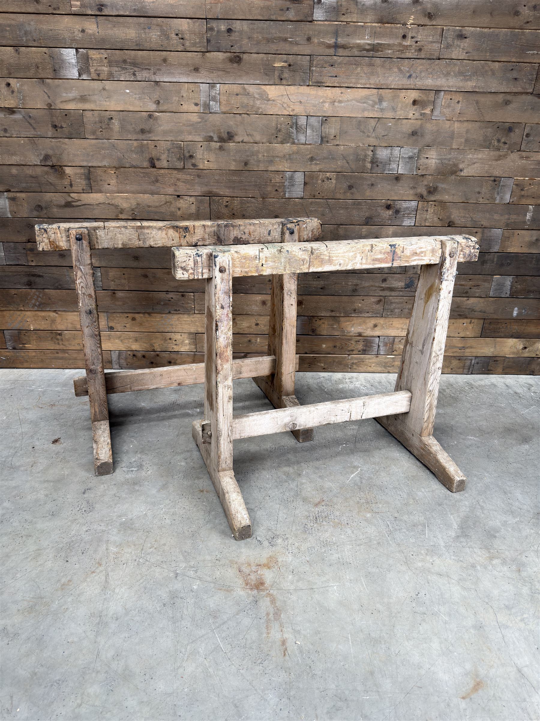 Pair of late 19th century pitch pine trestles, square tapering form in stripped finish