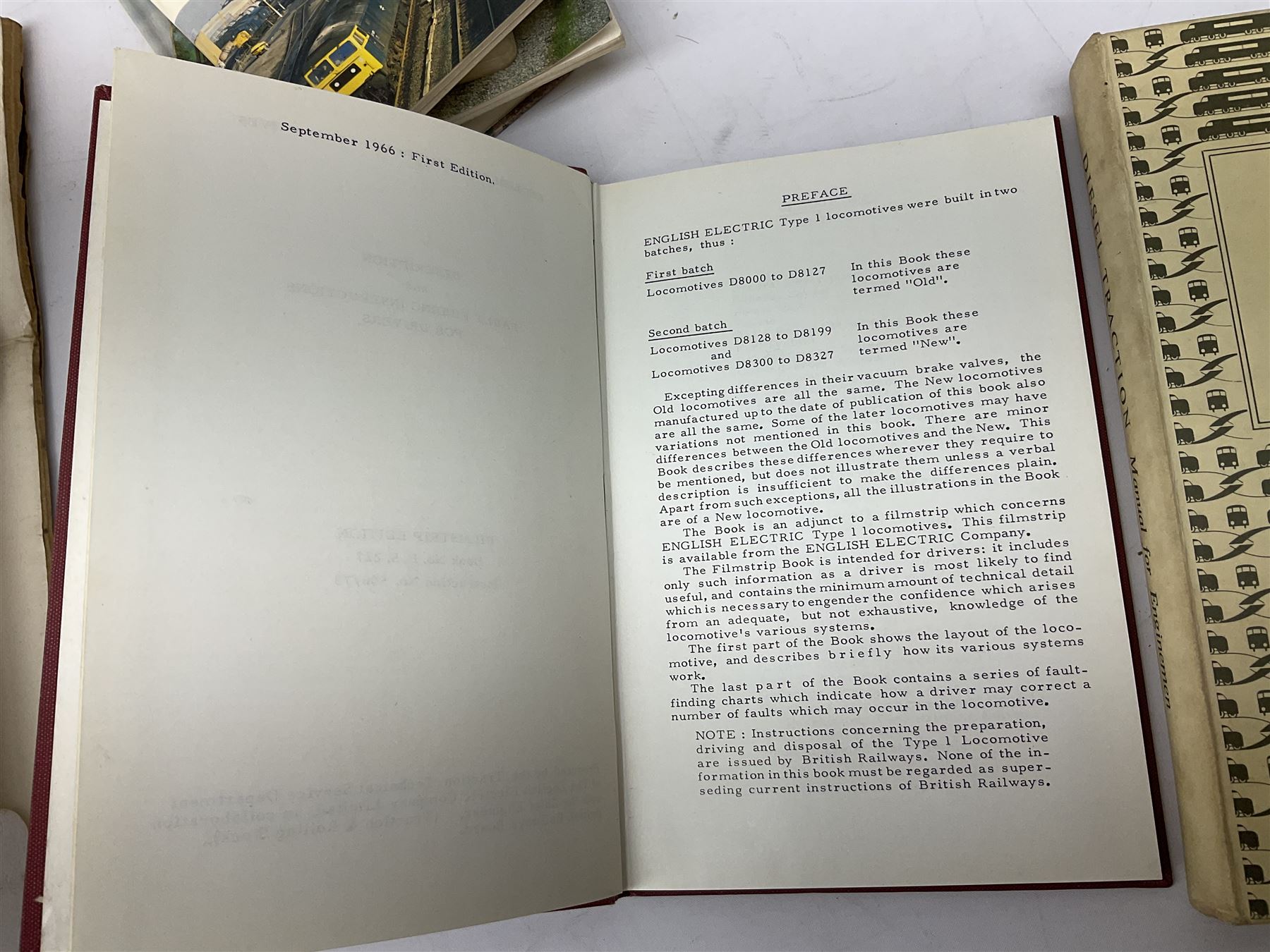 Black painted three colour railway lamp with revolving filters, H29cm; BR Acme Thunderer whistle; three railway peaked caps, two with BR Intercity 125 badge; small album of photographs of railway interest etc