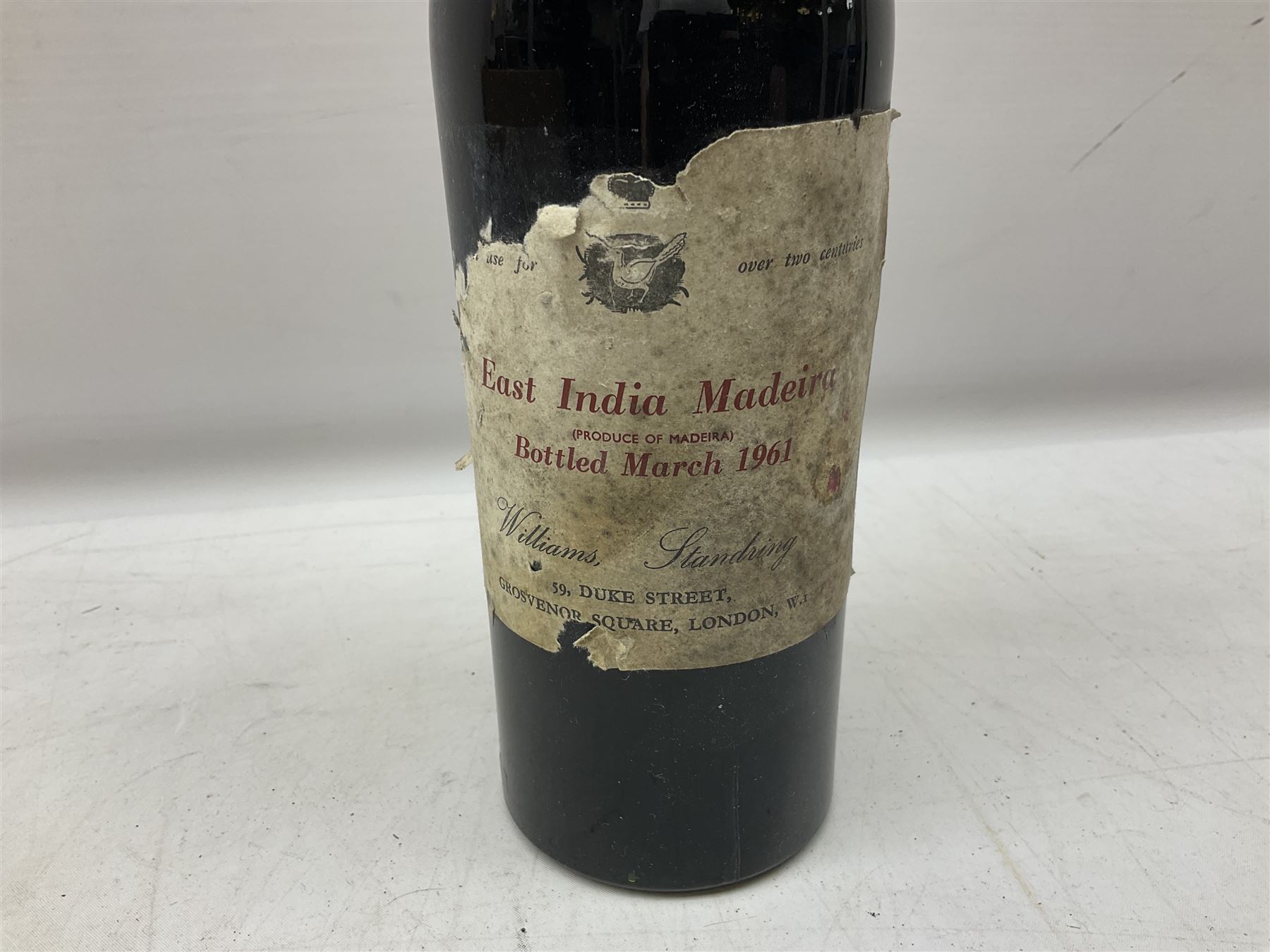 Four bottles of Haig's Dimple Old Blended Scotch whisky, all 26 2/3 Fl.OZs, 70 proof, one in original box and a bottle of East India 1961, Madeira, unknown contents and proof