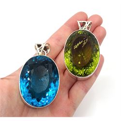 Two large silver green and blue stone set pendants, stamped 925
