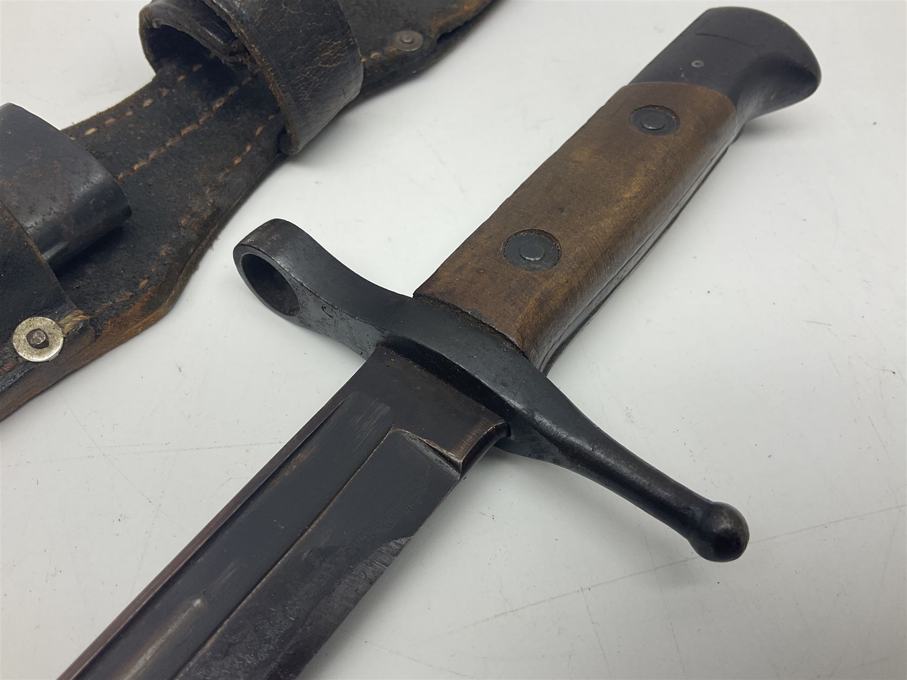 WW2 Italian Model 1891 bayonet with 30cm fullered blade; cross-piece marked PS 1941; in associated leather covered scabbard with frog L45cm overall